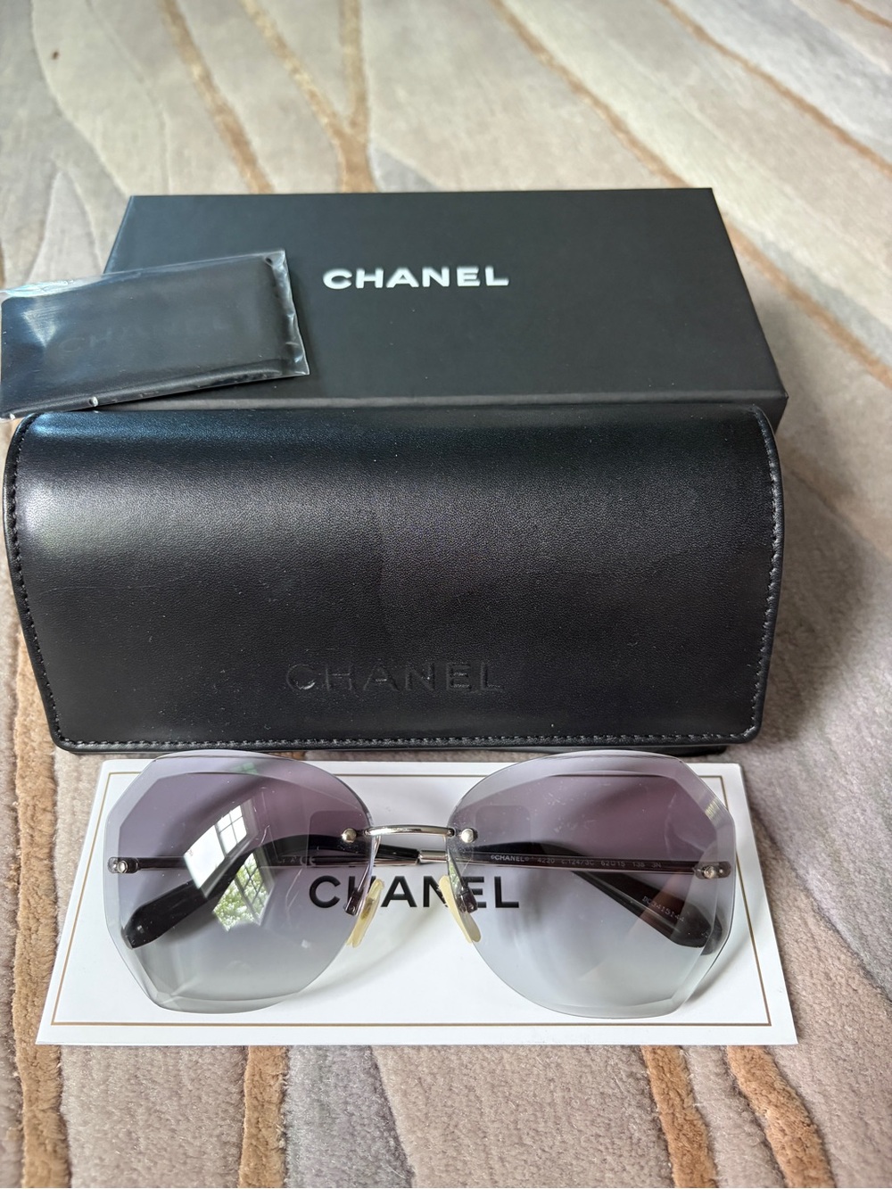 CHANEL Women's Rimless Sunglasses with Purple Gradient Lenses